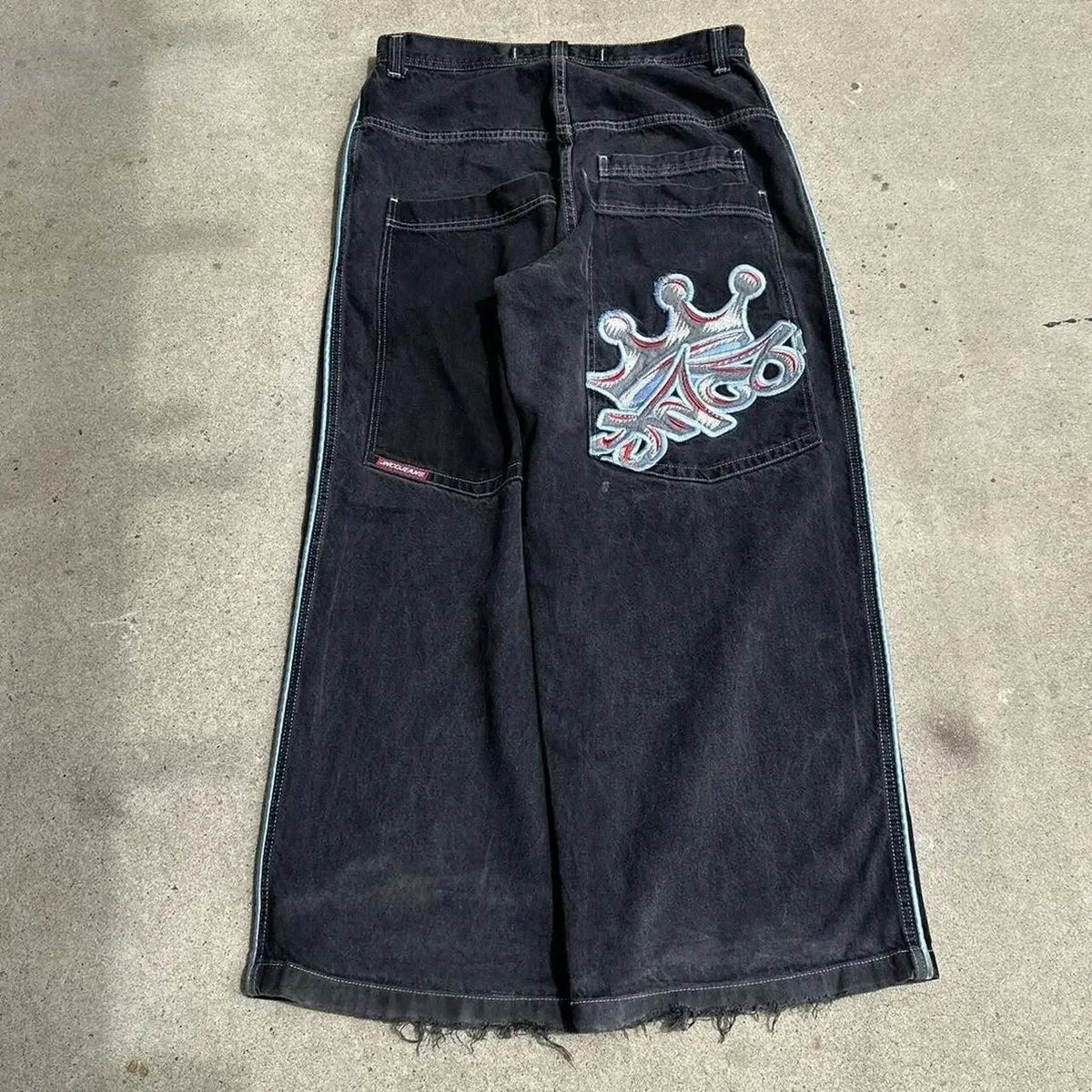 Baggy denim jeans with embroidered back pocket graphics
