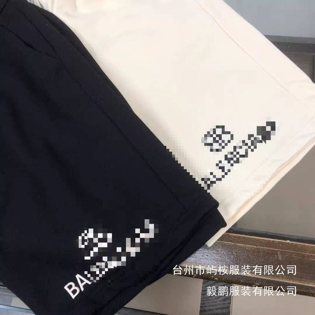 Black and beige cotton drawstring shorts with relaxed straight-leg fit