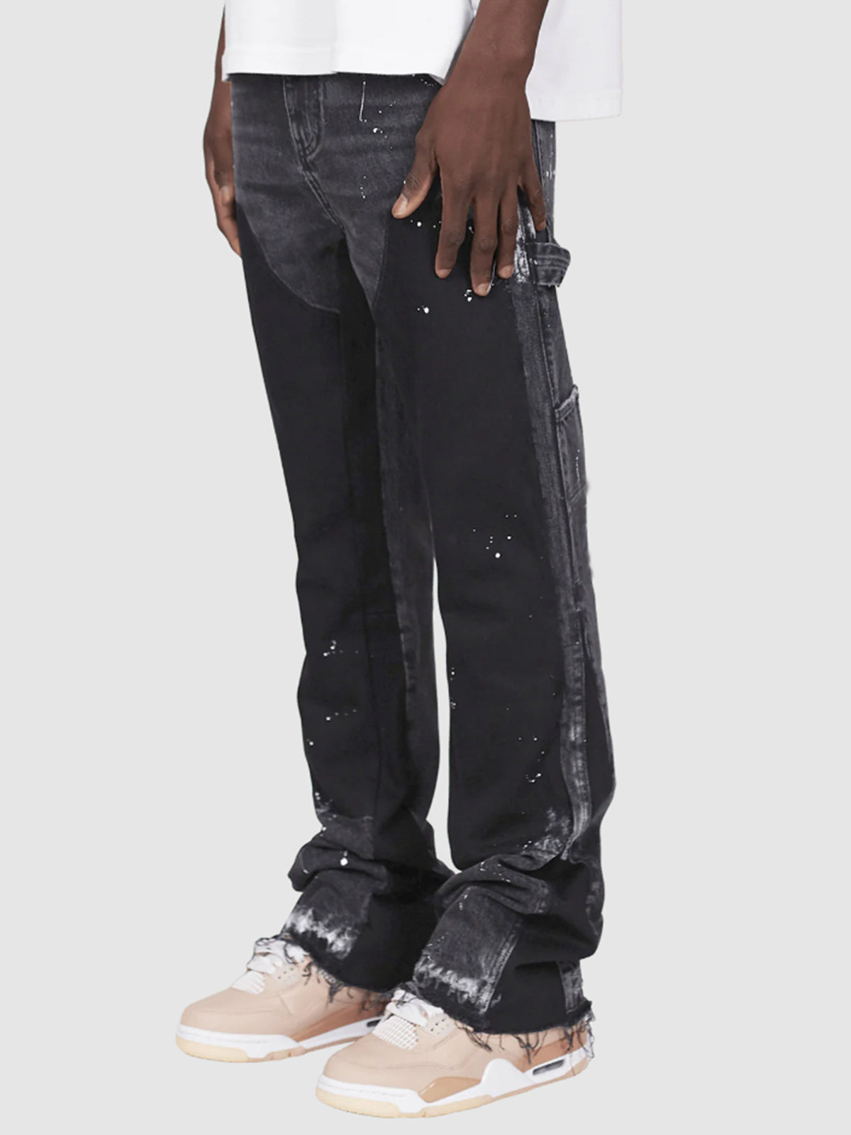 Distressed patchwork flare jeans with paint-splatter detailing