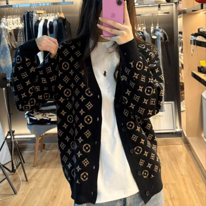 Black V-neck wool-blend sweater with tonal geometric pattern