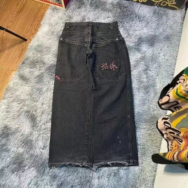Baggy denim jeans with embroidered back pocket graphics