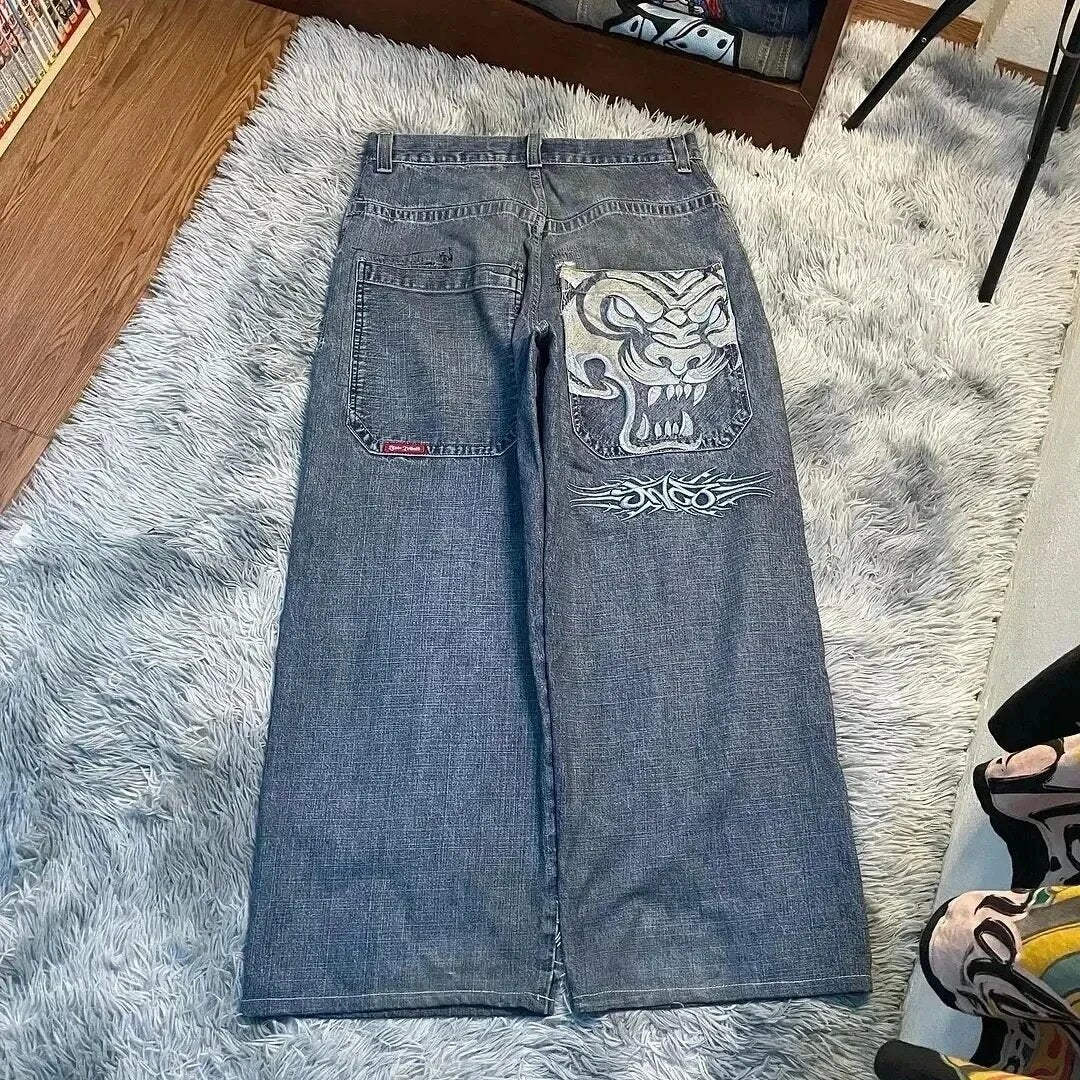 Baggy denim jeans with embroidered back pocket graphics