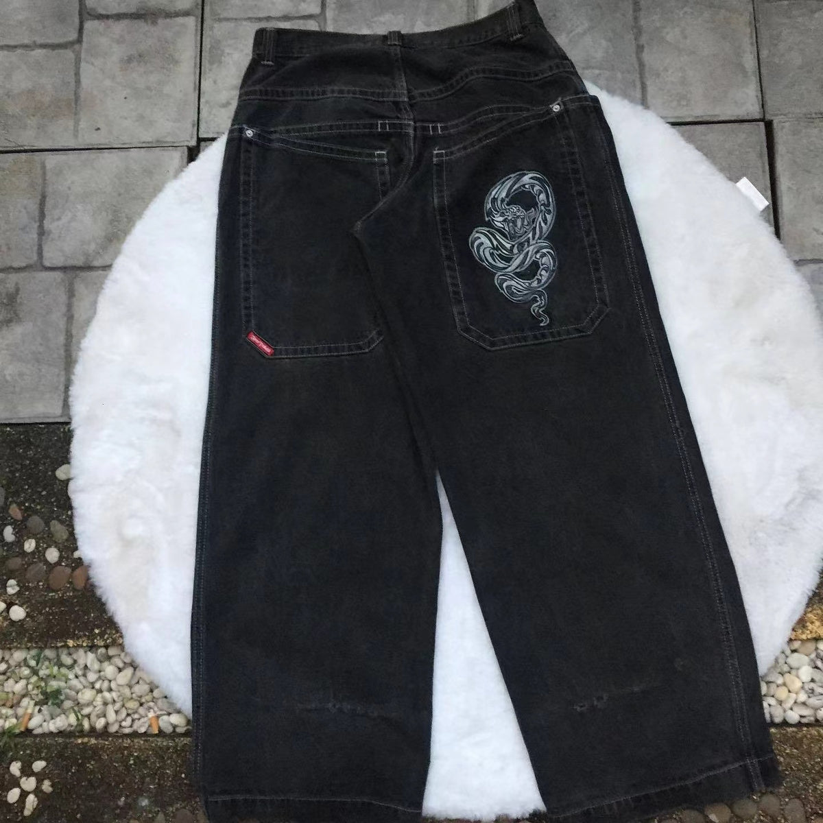 Baggy denim jeans with embroidered back pocket graphics