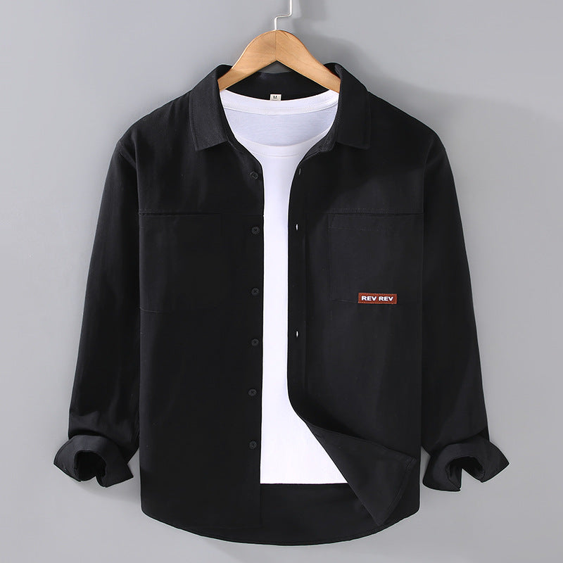 Beige long-sleeve cotton shirt with chest pockets and black buttons