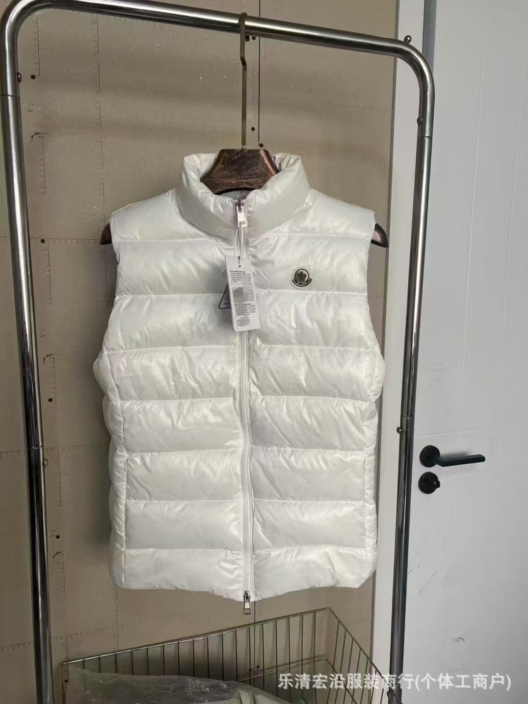 Ribbed Black Puffer Vest with Diagonal Zipper and Stand Collar
