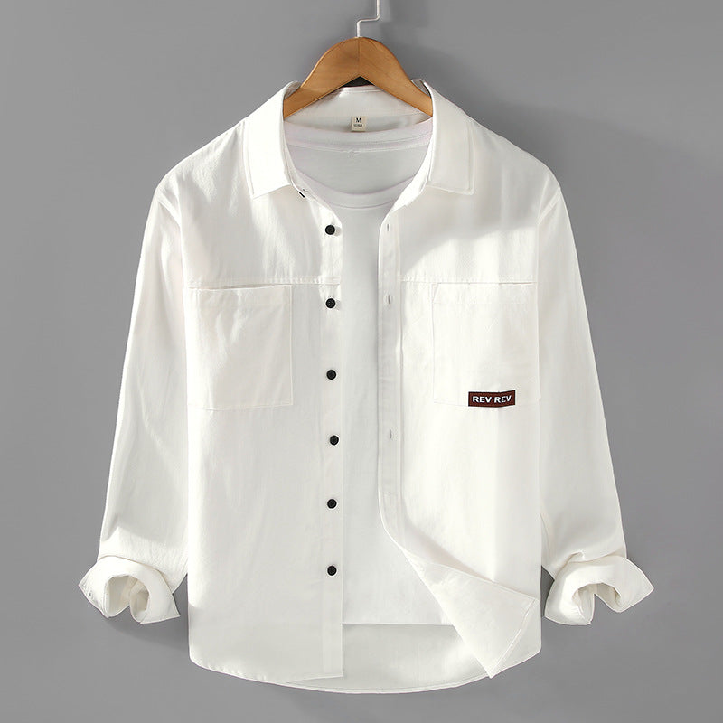Beige long-sleeve cotton shirt with chest pockets and black buttons