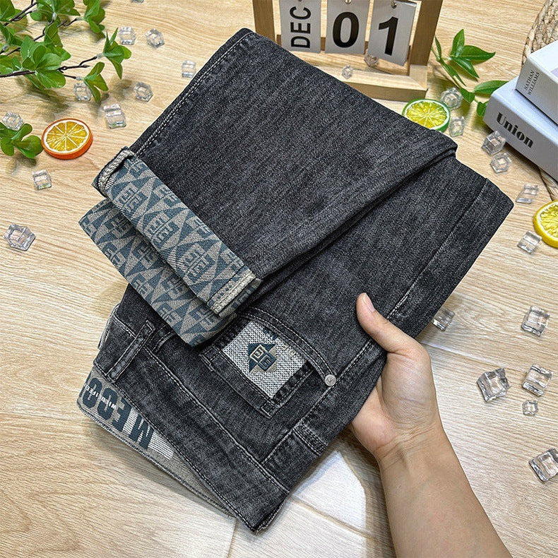 Lightweight stretch denim jeans with slim fit and tapered leg