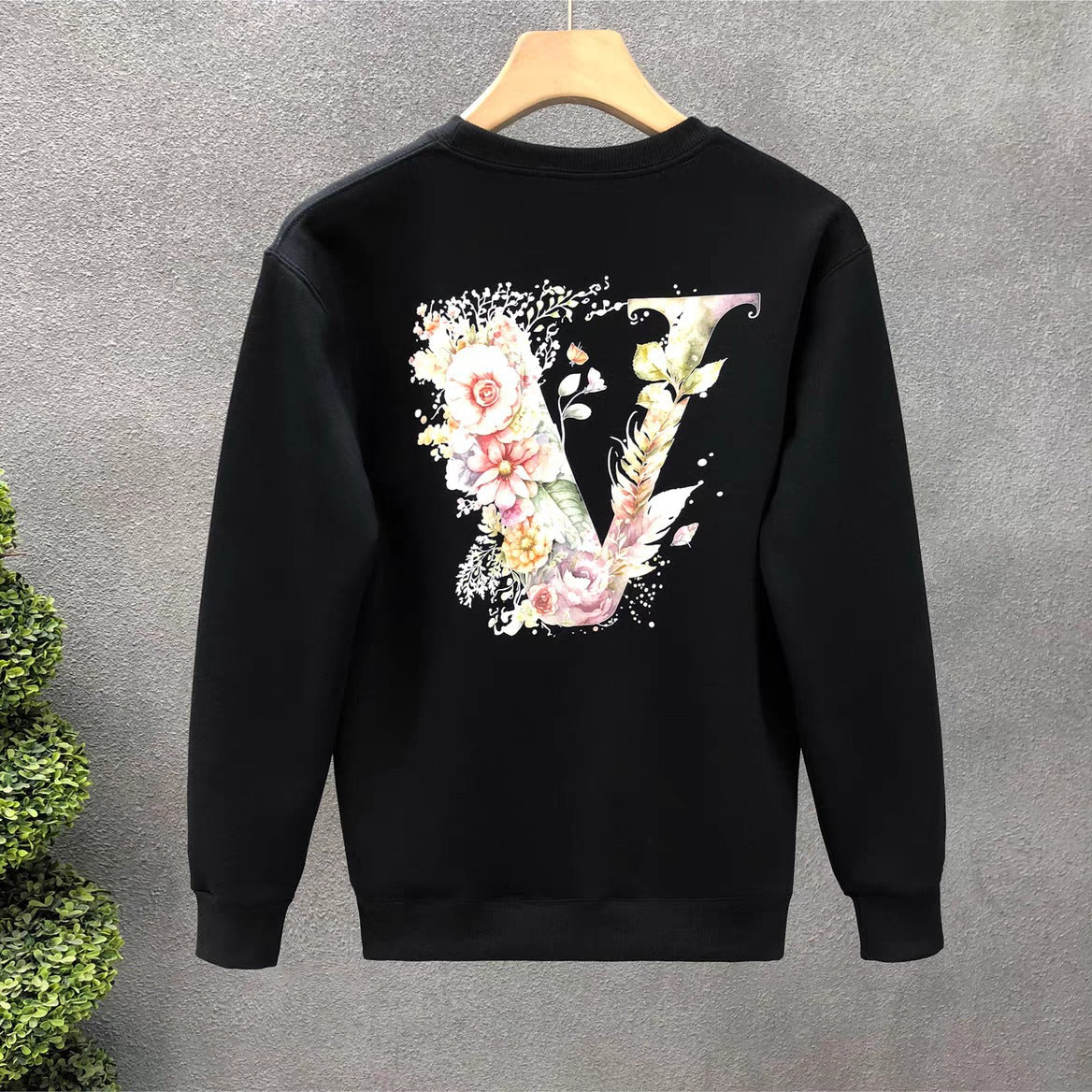 Embroidered black bomber jacket with leather patch