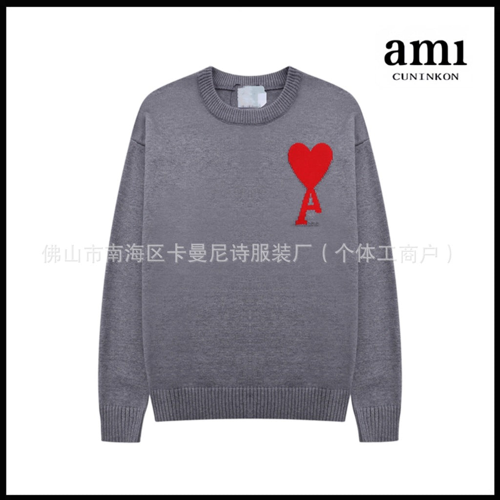 Black knit cardigan with red heart-balloon intarsia motif