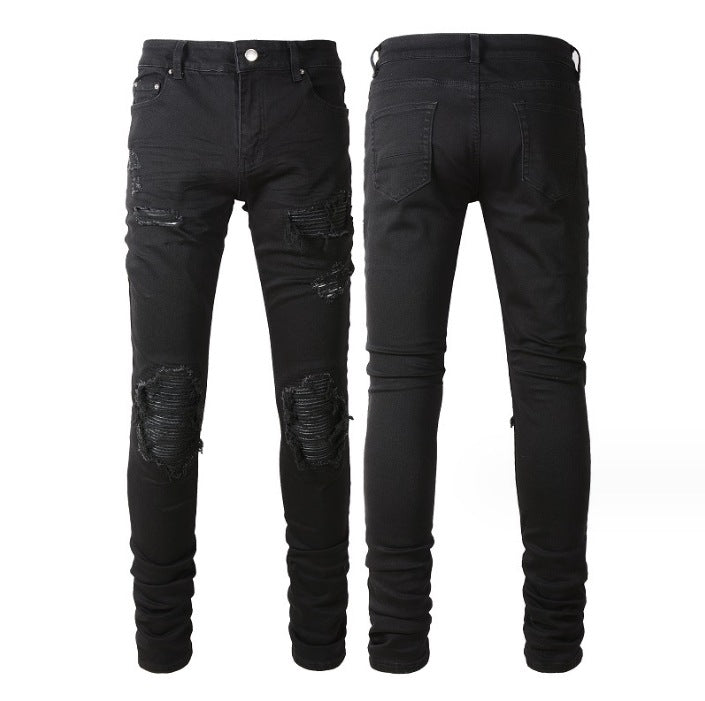 Black distressed slim-fit jeans with knee rips and patch details