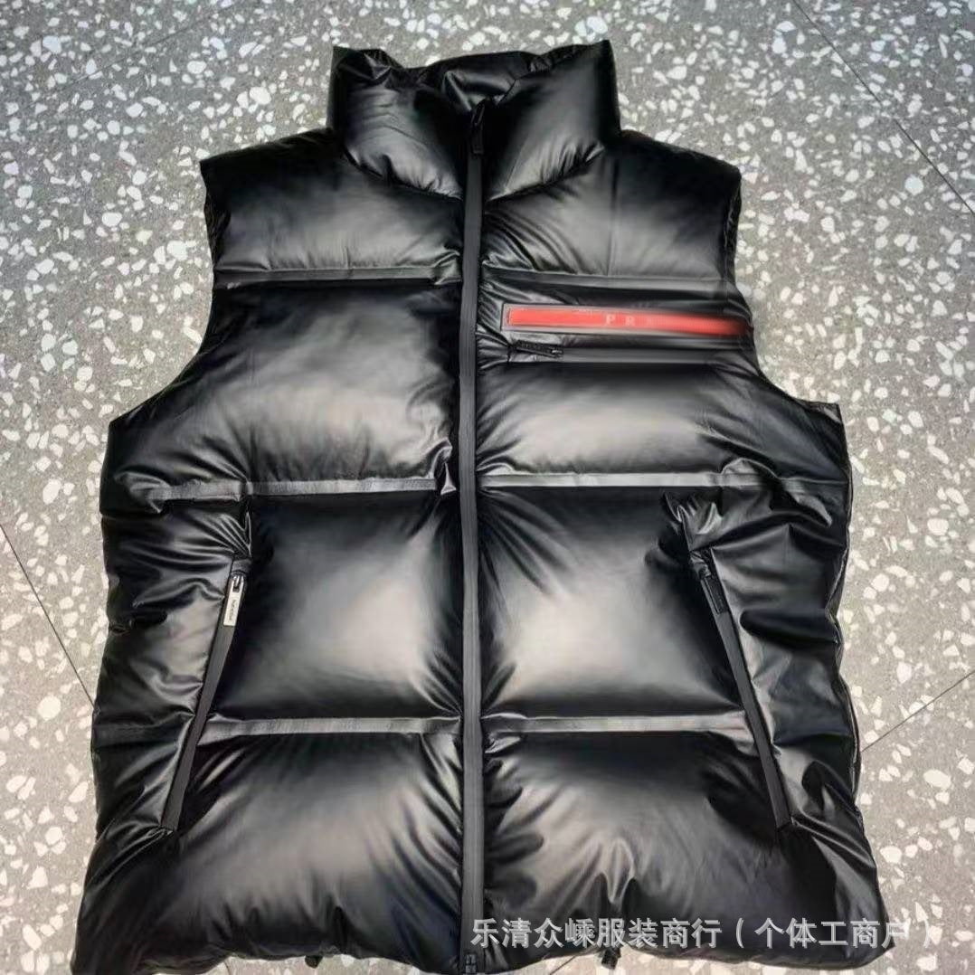 Black glossy quilted puffer jacket with ribbed collar and zip closure