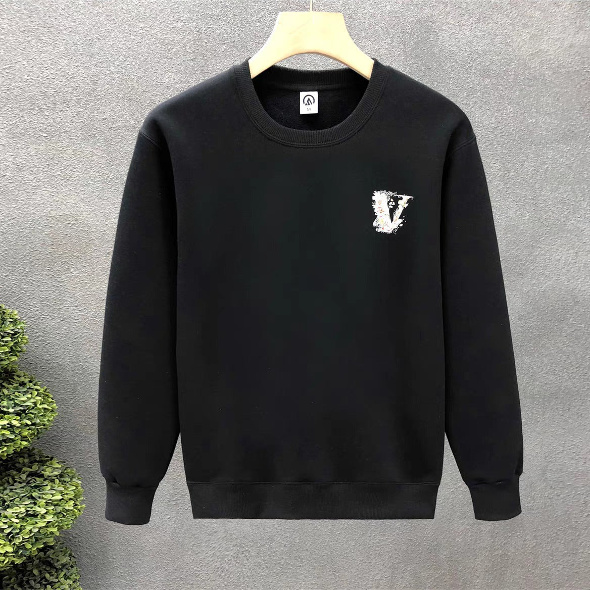 Embroidered black bomber jacket with leather patch