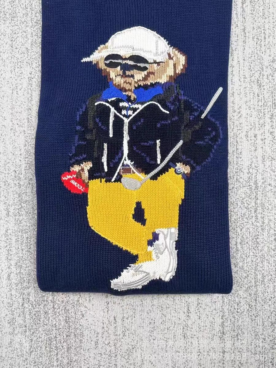 Navy crewneck sweater with embroidered bear holding golf club