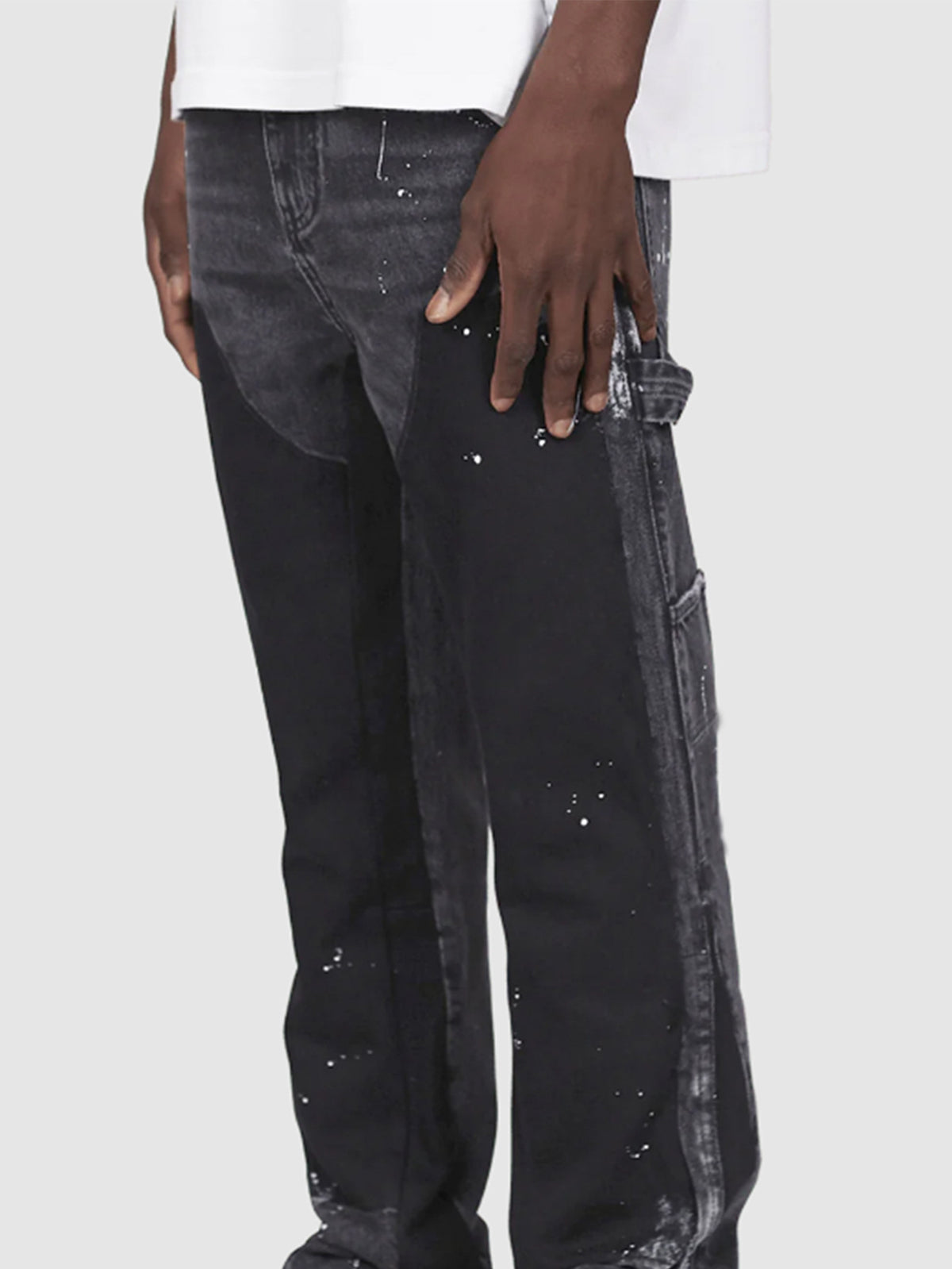 Distressed patchwork flare jeans with paint-splatter detailing