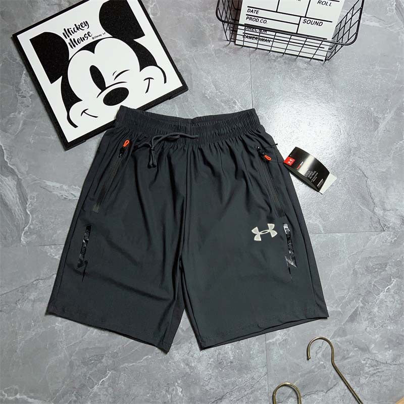 Black and gray athletic shorts with side zippers