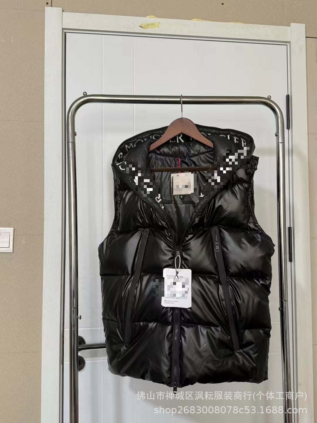 Black quilted nylon puffer jacket with hood and front zipper