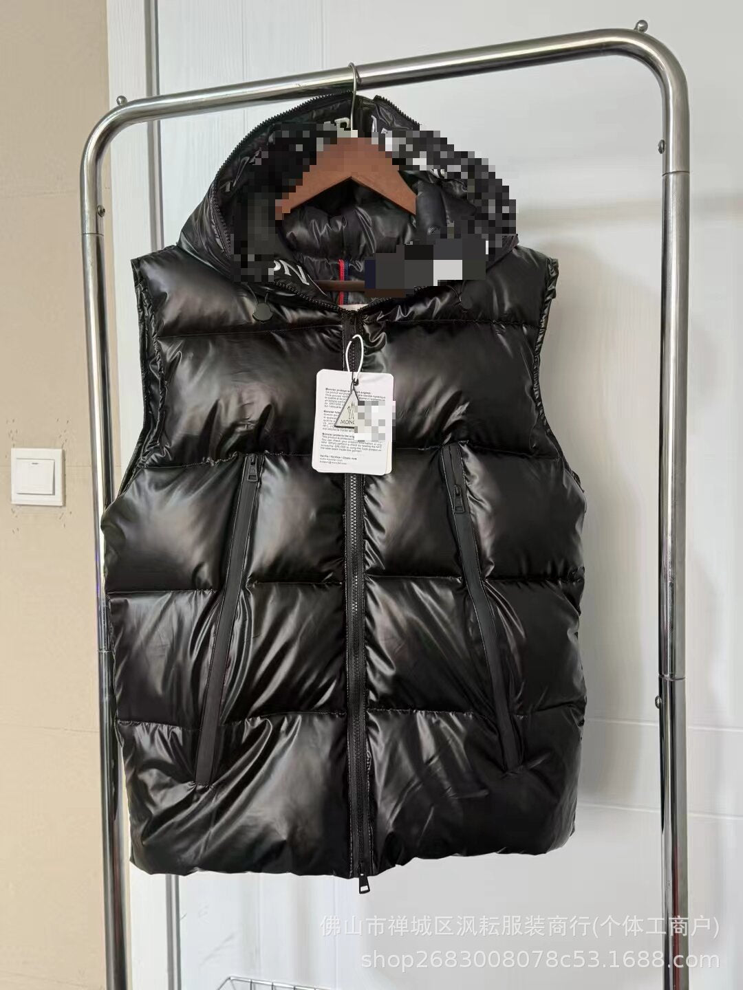 Black quilted nylon puffer jacket with hood and front zipper