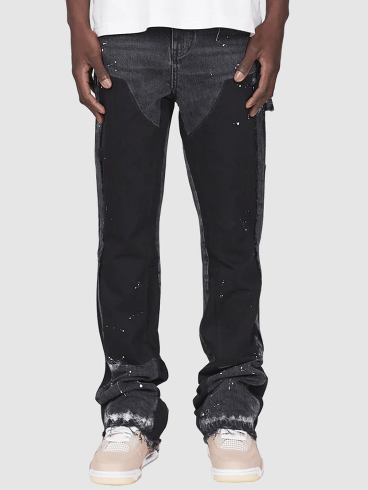 Distressed patchwork flare jeans with paint-splatter detailing