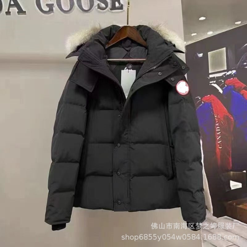 Black puffer coat with fur-trimmed hood and oversized pockets