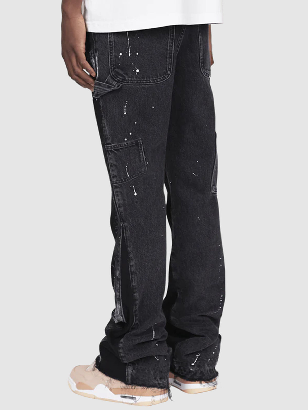 Distressed patchwork flare jeans with paint-splatter detailing