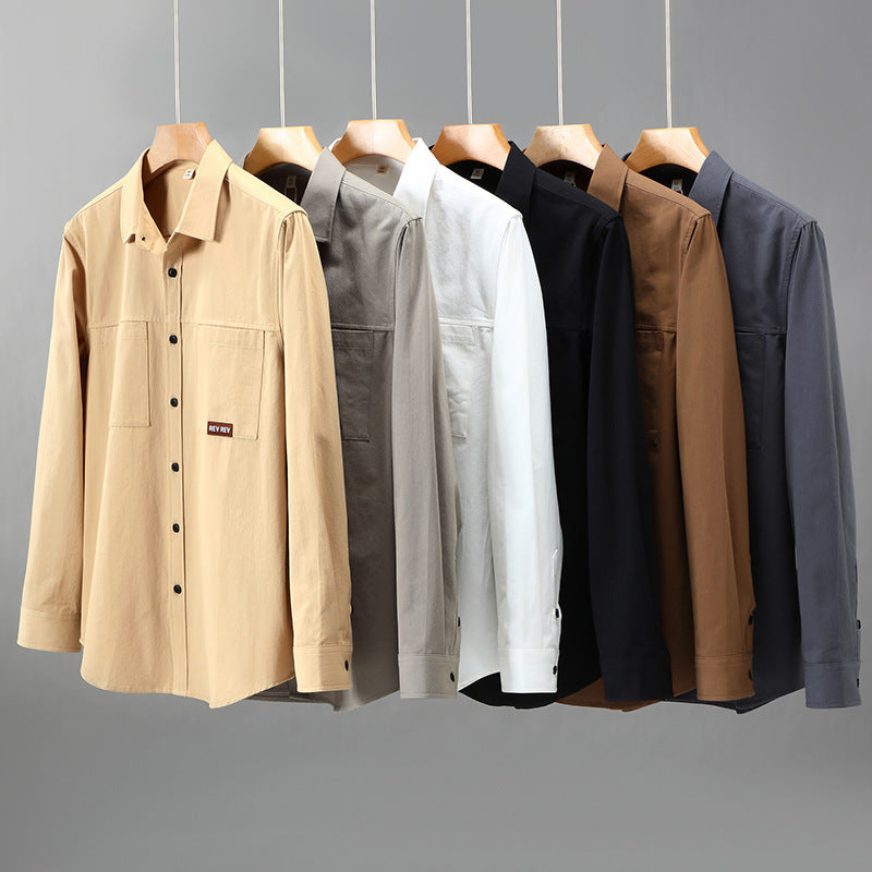 Beige long-sleeve cotton shirt with chest pockets and black buttons