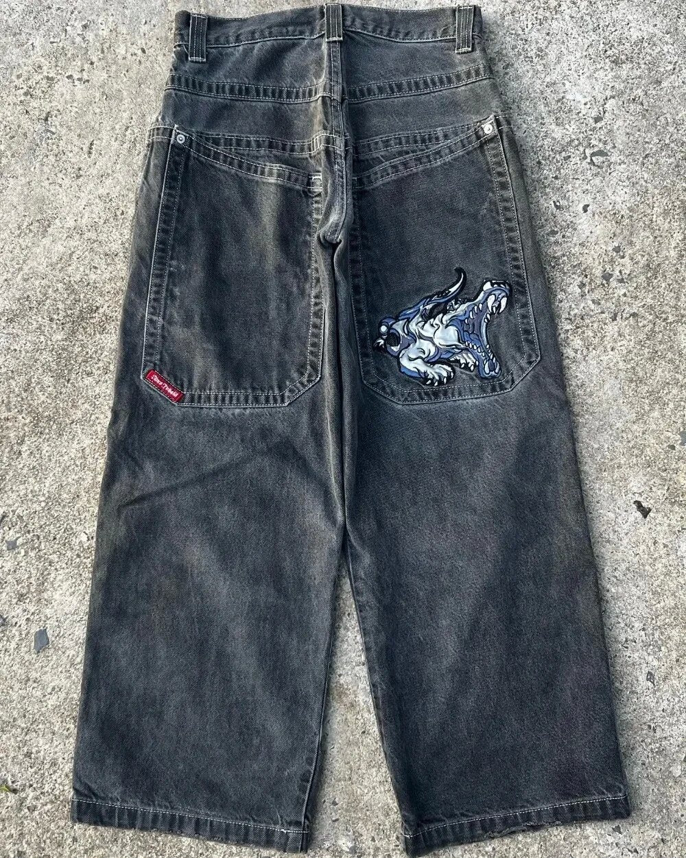Baggy denim jeans with embroidered back pocket graphics