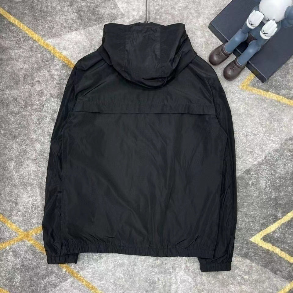 Black or gray hooded windbreaker jacket with zip pockets