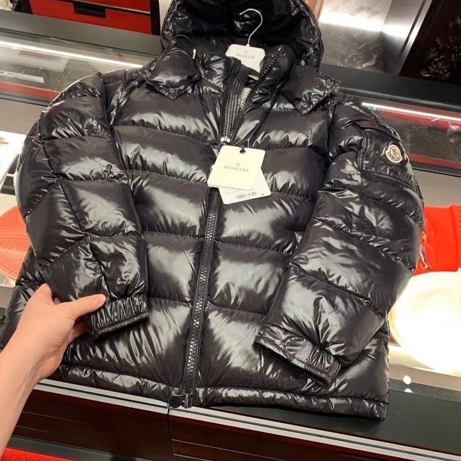 Black quilted puffer coat with insulated down fill and adjustable hood
