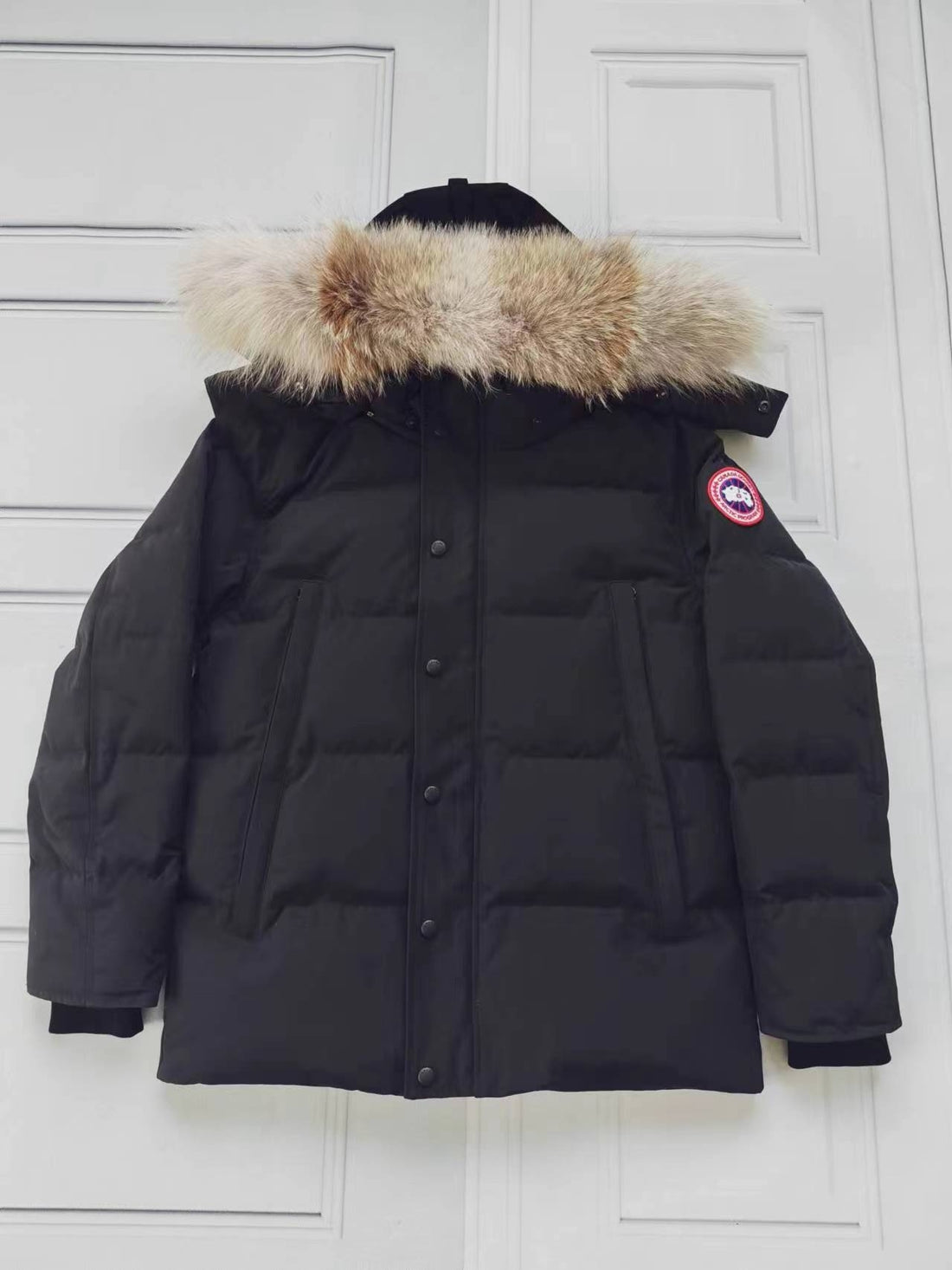 Black puffer coat with removable fur-trimmed hood