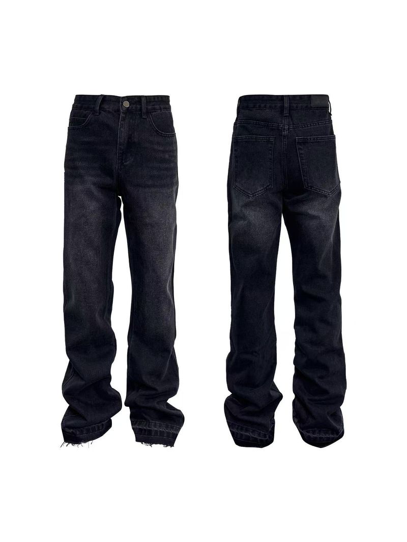 Distressed flared jeans with frayed hem and vintage grey wash