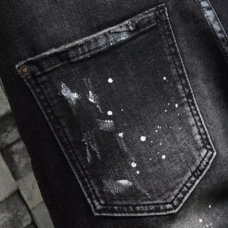 Black Paint-Splattered Denim Shorts with Rips and Patches