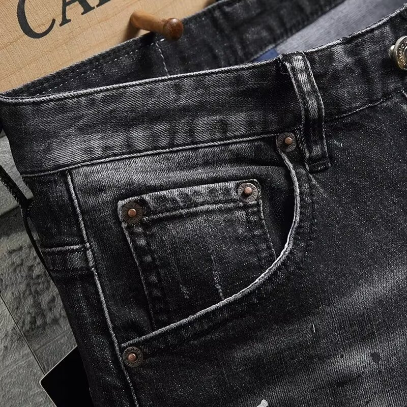 Black Paint-Splattered Denim Shorts with Rips and Patches