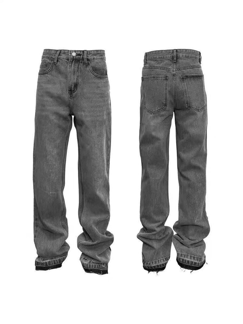 Distressed flared jeans with frayed hem and vintage grey wash