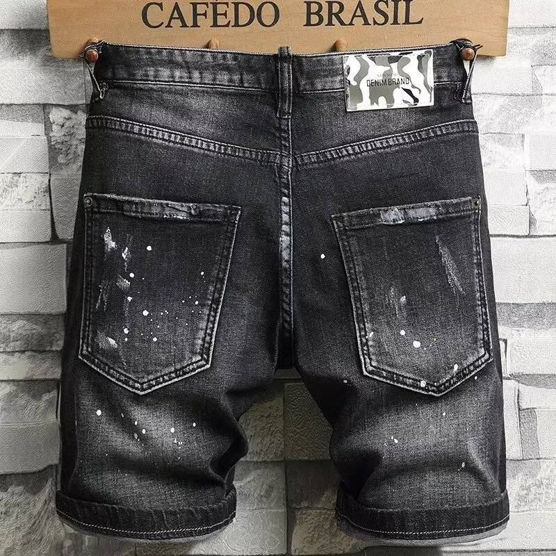 Black Paint-Splattered Denim Shorts with Rips and Patches