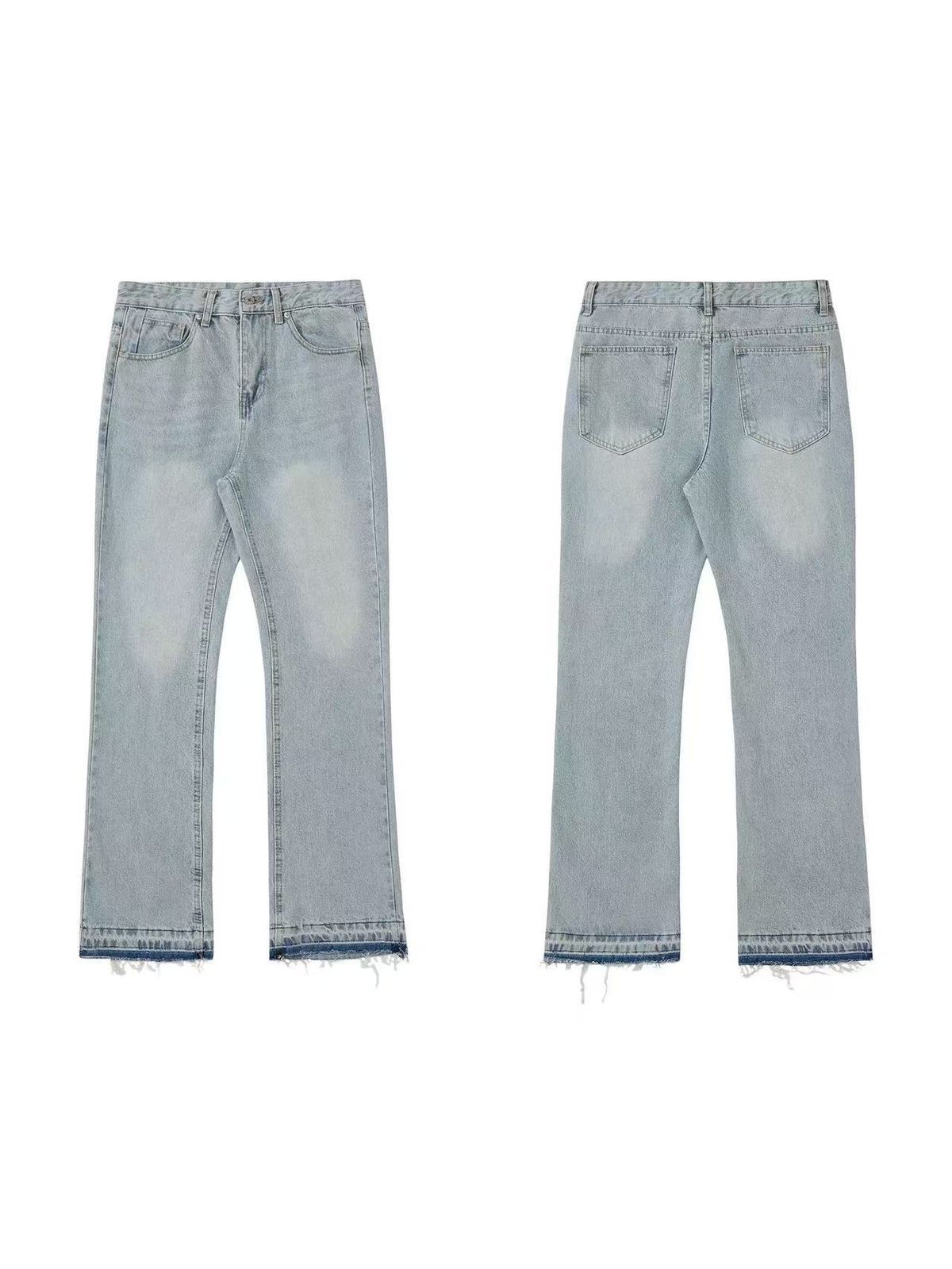 Distressed flared jeans with frayed hem and vintage grey wash